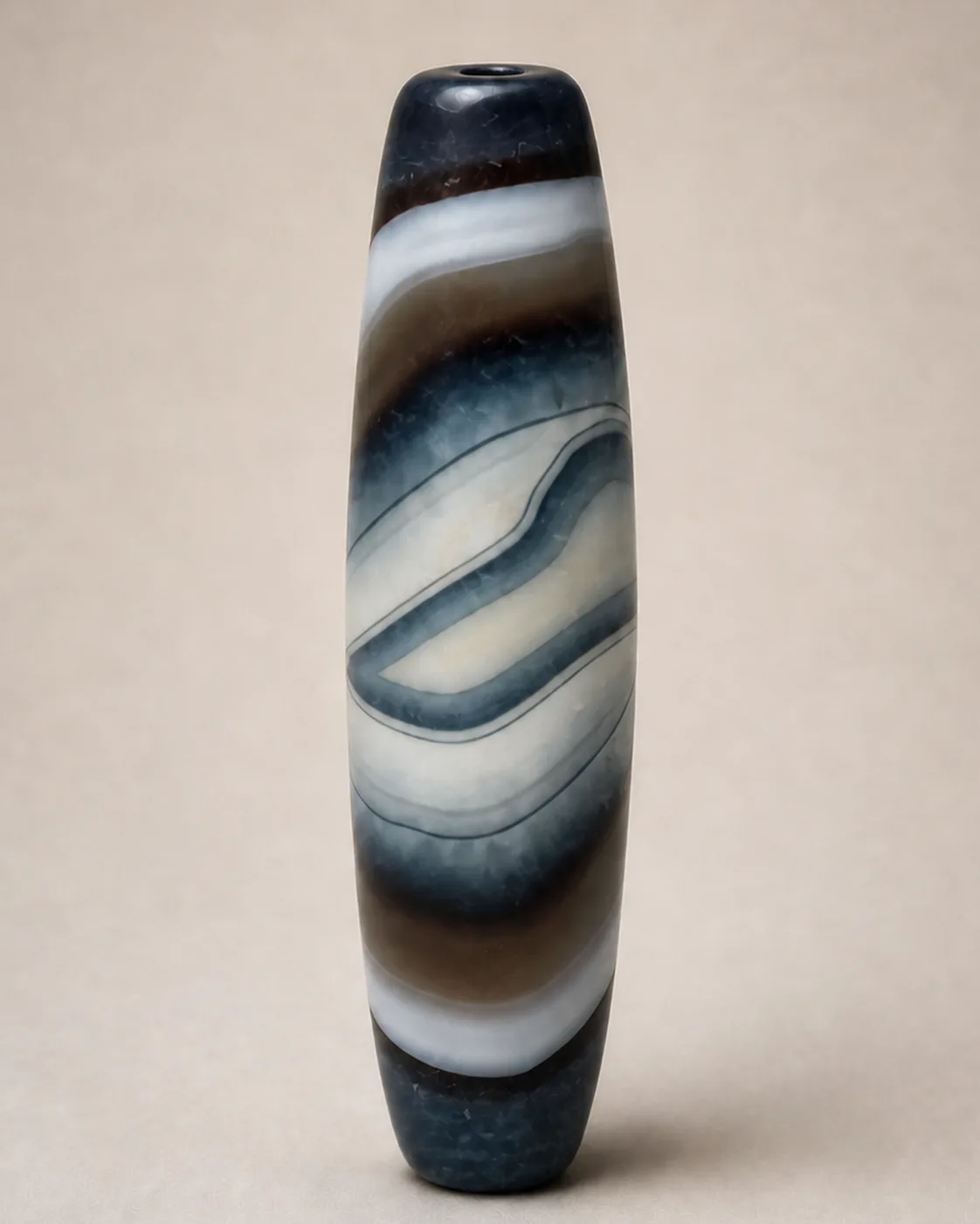 Banded Agate Dzi Bead with flowing blue-grey and cream layers along a slender profile — approx. 59.4 × 16.5 mm | Front