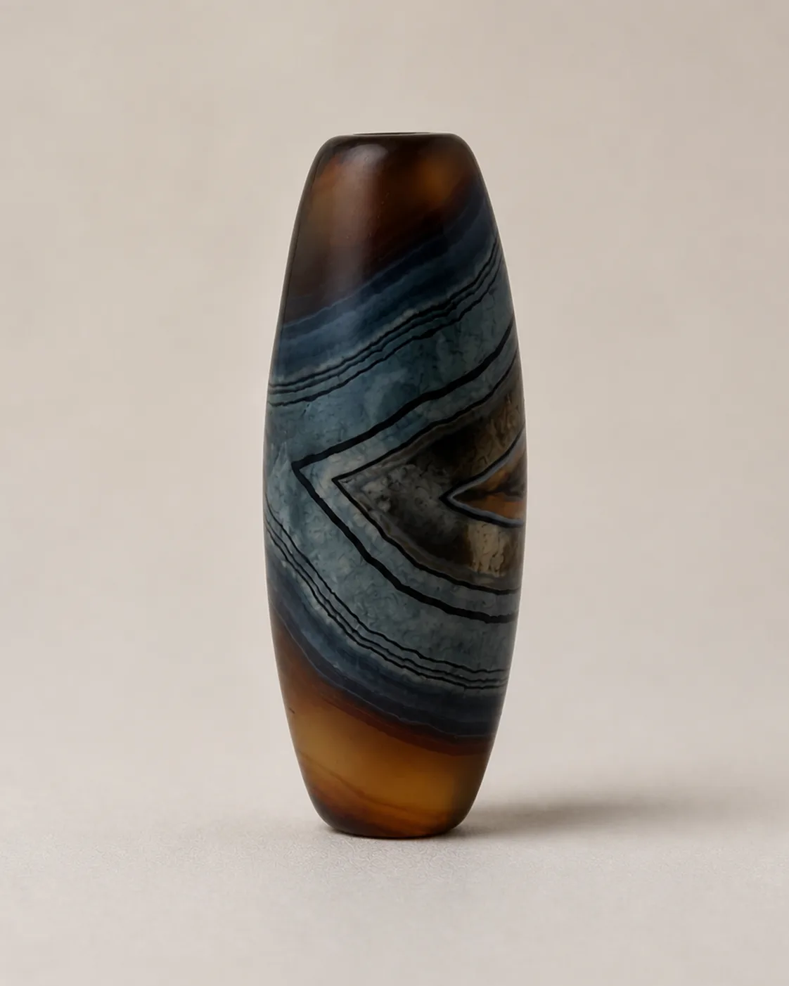 Banded Agate Dzi Bead with centred nested-chevron bands — approx. 39.9 × 15.2 mm | Front