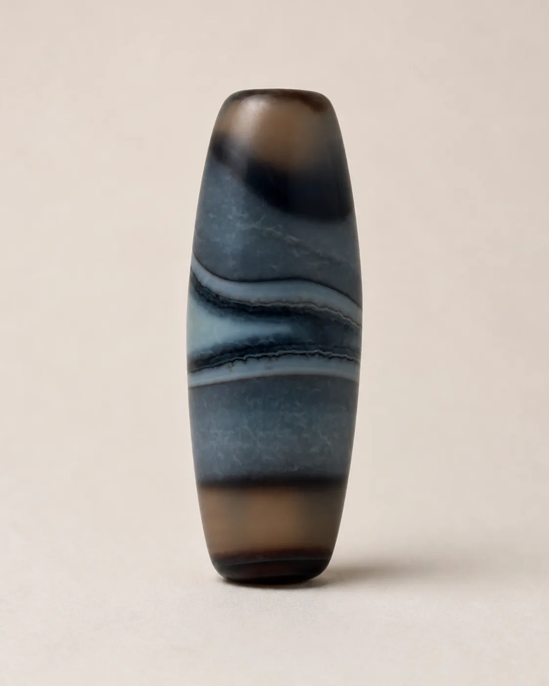 Banded Agate Dzi Bead with blue-grey vertical layers between brown ends — approx. 40.5 × 14.6 mm | Front