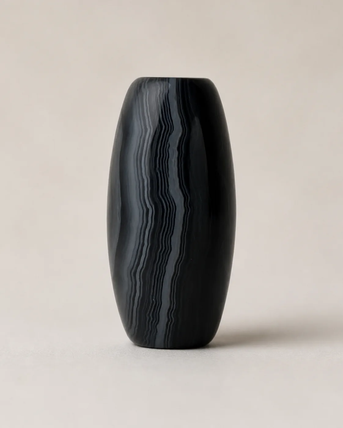 Banded Agate Dzi Bead with a dark upper field above fine horizontal grey-blue layers — approx. 28.9 × 14.5 mm | Front