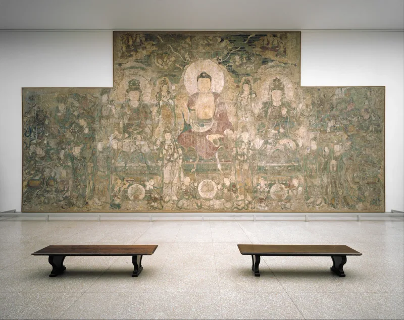Yuan-period Medicine Buddha mural displayed at The Metropolitan Museum of Art, with a large assembly around the central Buddha.
