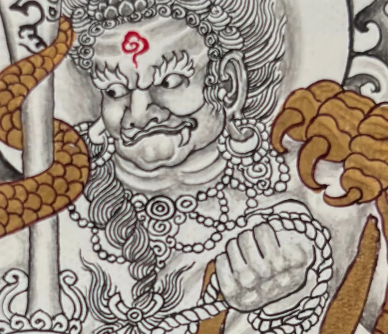 Detail view of a current miniature thangka with a sword-bearing figure and dragon motif