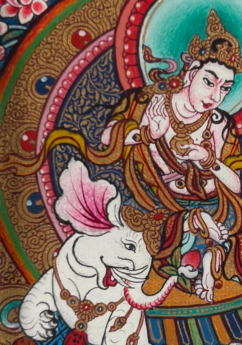 Detail view of a miniature thangka showing a central figure, white elephant and surrounding colour field