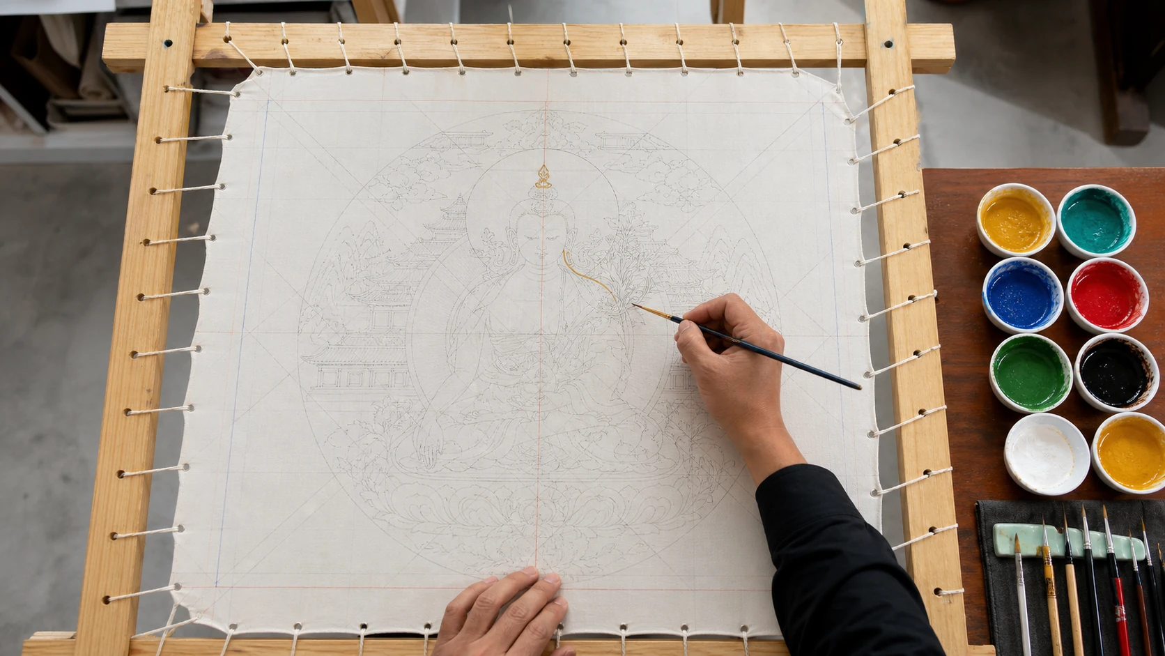 An overhead editorial reconstruction of measured line drawing on prepared cloth laced to a wooden frame, with brushes and pigment bowls