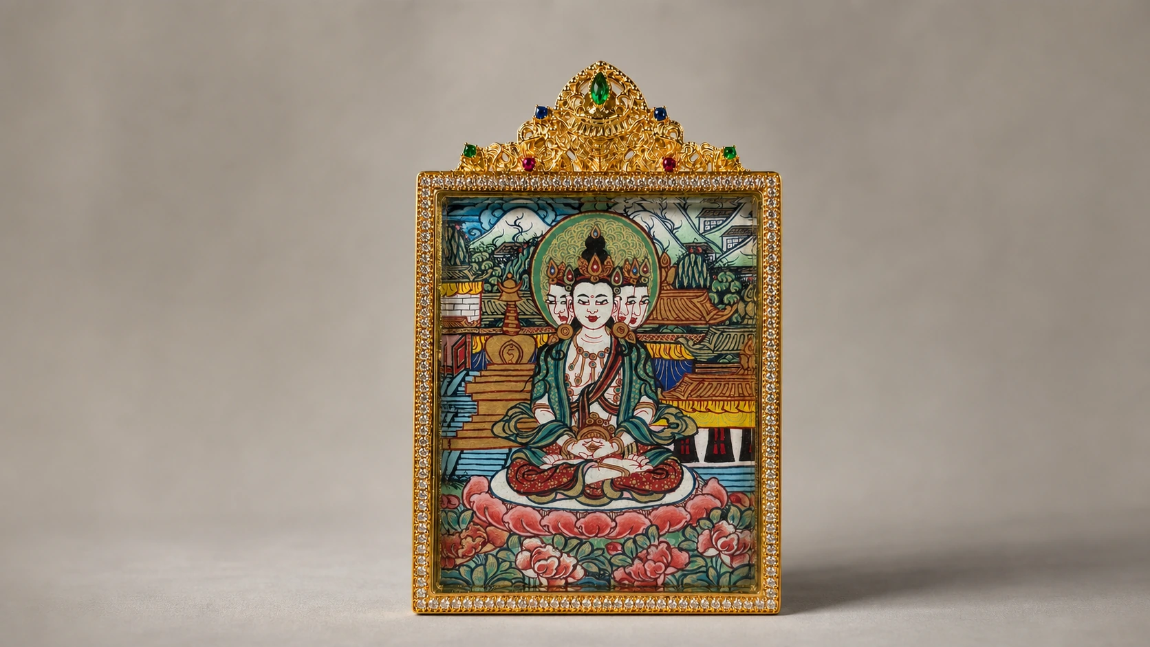 A close editorial view of a framed miniature thangka against a quiet neutral background