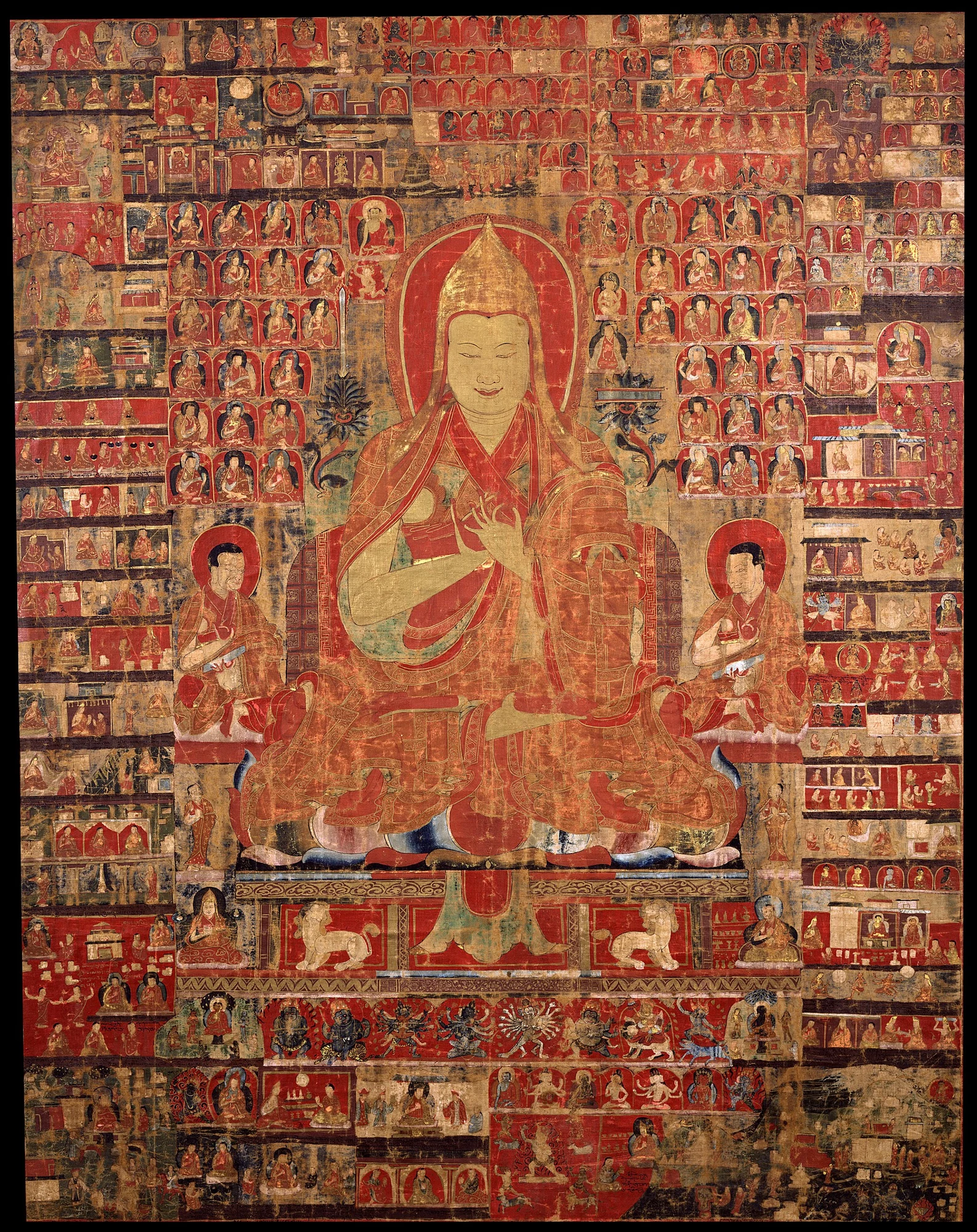 Central seated teacher surrounded by dense narrative panels.