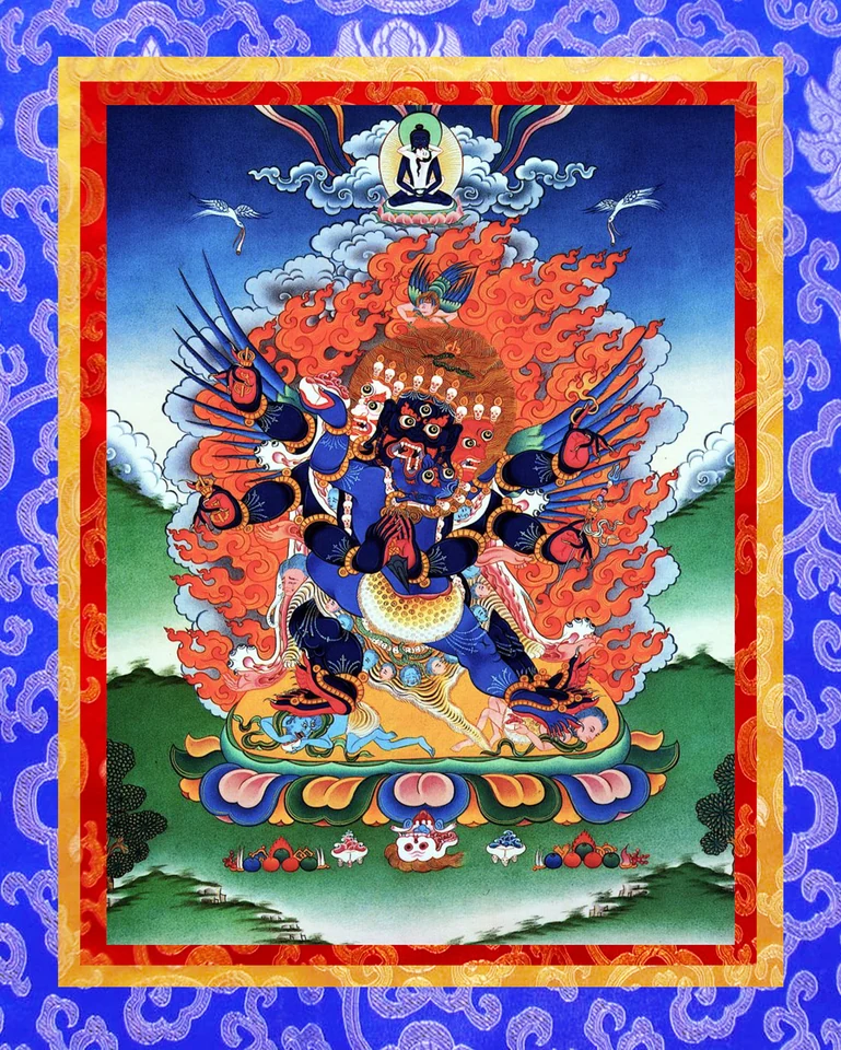 Vajrakilaya with three faces and spreading arms amid red flames