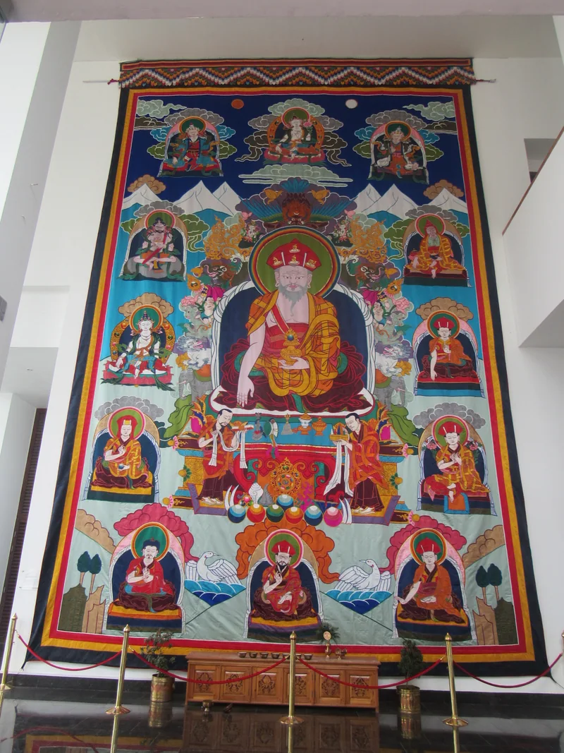 An appliqué image of Zhabdrung Ngawang Namgyal in the Bhutan Textile Museum, with its surrounding textile border.