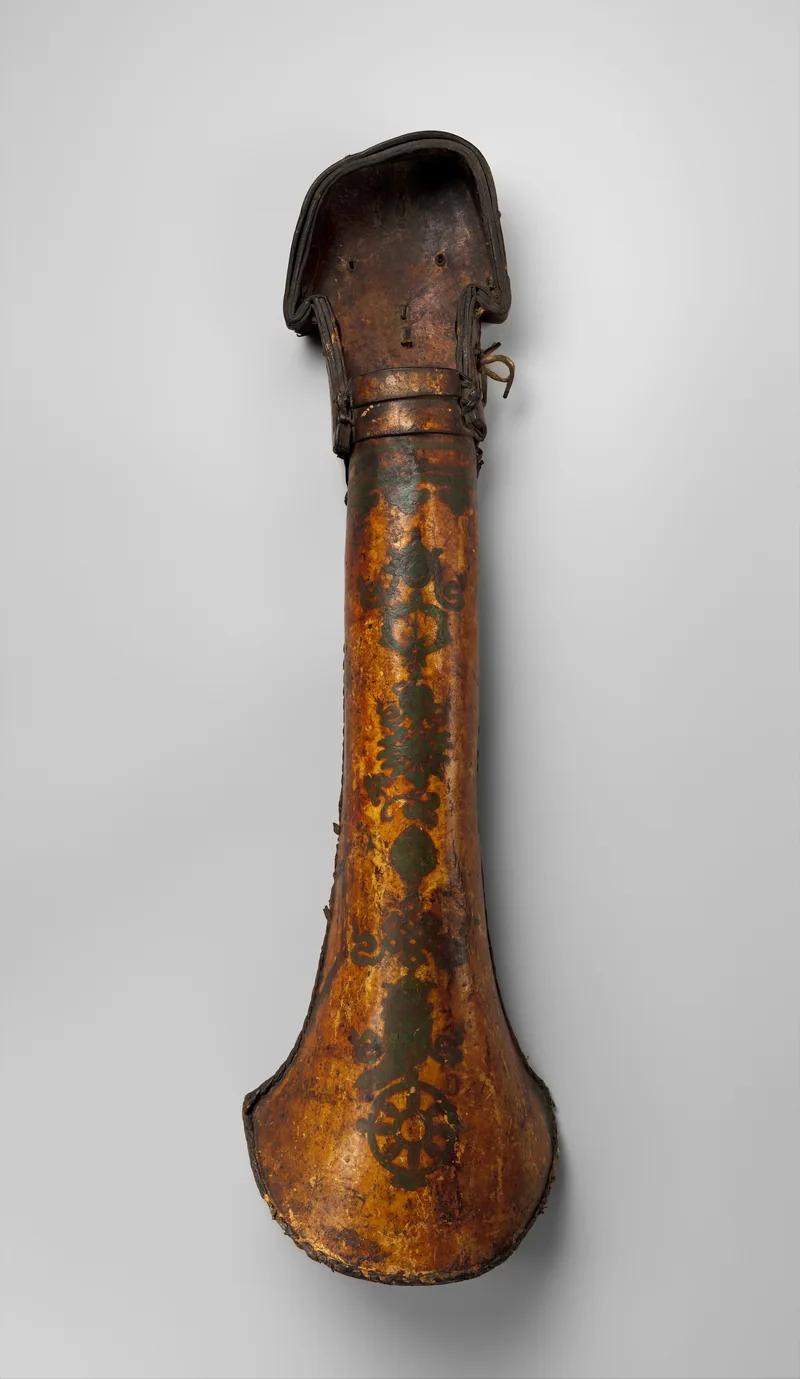 Complete worn leather quiver, long and narrow with a flared base, decorated vertically with dark auspicious motifs.
