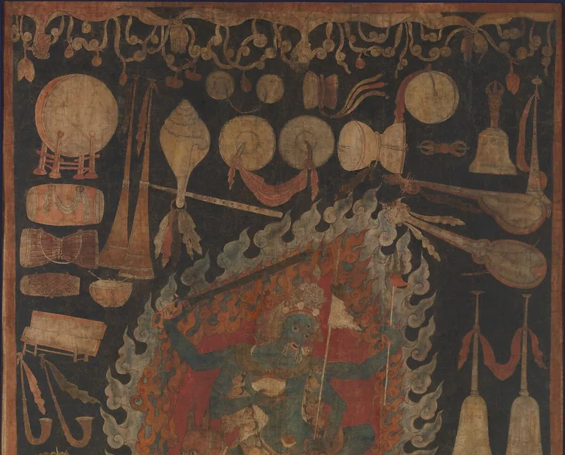 Upper detail of the painting, showing the four-armed central figure and instruments arranged around the flames.