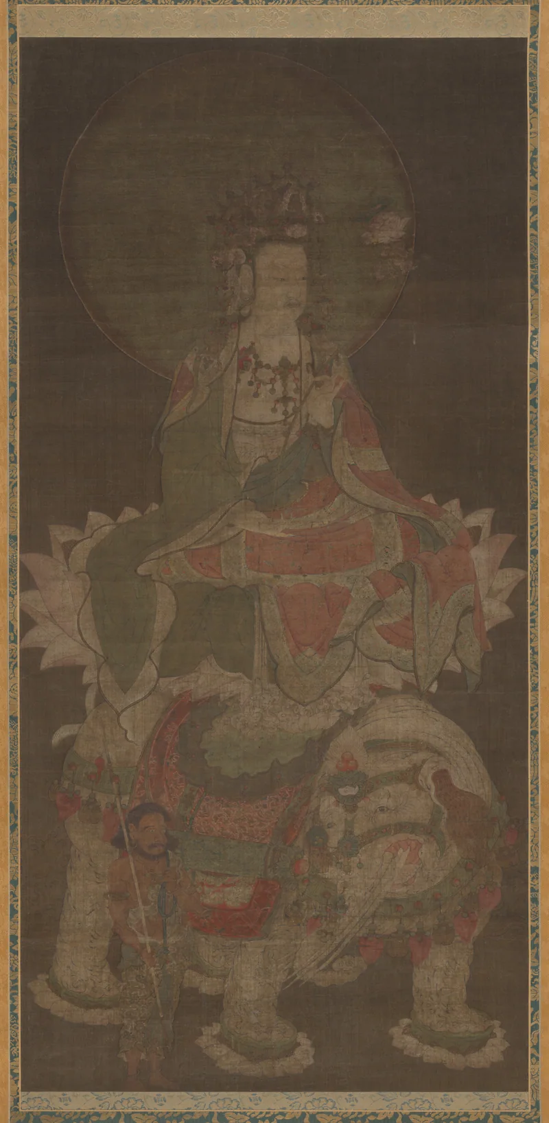 普贤手持承托经书的莲花，坐于白象之上