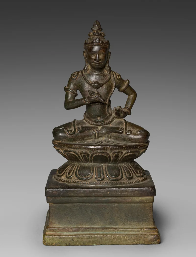 Angkor-period bronze Vajrasattva with curved ornamental cords
